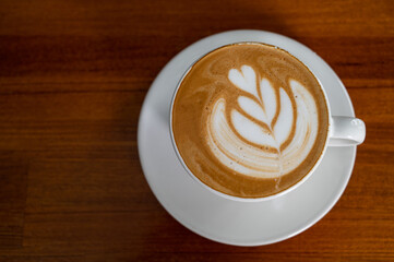 hot latte art coffee on table, relax time