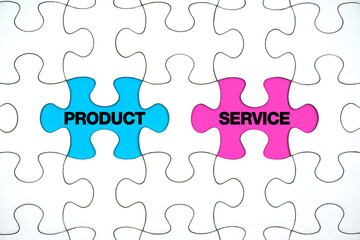 Missing puzzle pieces with the words PRODUCT versus SERVICE. Service as business concept and planning.                            