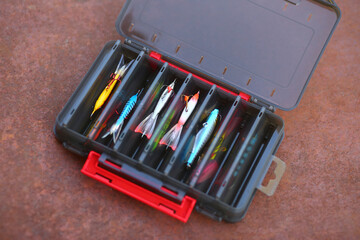 Fisherman box full of different tuckes, baits, hooks, plugs and lures