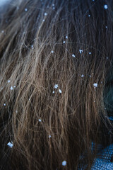Snow flakes stuck in girl's hair