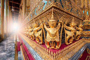 Golden garuda statues in Wat Phra Keaw (The Royal Grand Palace), Those are building around Temple of Emerald Buddha, Bangkok, Thailand. 