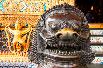 The lion statues in Wat Phra Keaw (The Royal Grand Palace), Those are building around Temple of Emerald Buddha, Bangkok, Thailand.