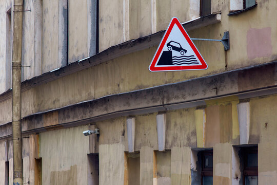 Sign Of A Car Falling Off A Cliff Into The Water