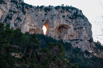 Scenic view on rock formation Montepertuso Il Buco on hiking trail Path of Gods between Positano and Praiano, Amalfi Coast, Campania, Italy, Europe. Hole in a cliff rock at the Mediterranean Sea