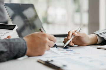 The sales department is having a monthly summary meeting to bring it to the department manager, they are verifying the correctness of the documents that are prepared before bringing in to the manager