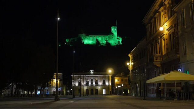 City Centre of Lubiana (Ljubljana) at night, Kongres square (Kongresni trg), Slovenia. View of castle with green lights and city lights.