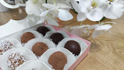 candies in a box near the orchid