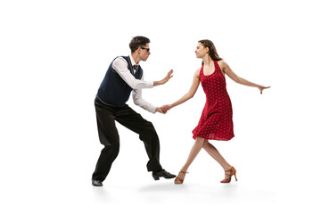 Beautiful girl and stylish man in vintage retro style outfits dancing isolated on white background....