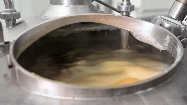 Brew tank with boiling malt. High quality 4k footage