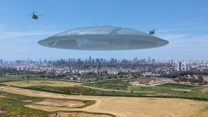 3d rendering, Massive ufo Flying saucer hovering over large city Aerial view
Drone view over tel...