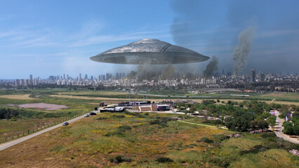 3d rendering,Massive ufo Flying saucer hovering over destroyed city Aerial view
Drone view over...