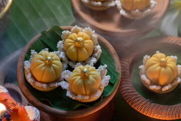 Fototapeta na wymiar Close up view of several Thai traditional desserts served on banana leaves
