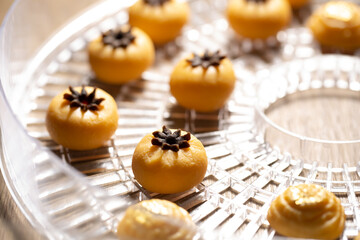 Close up view of several Thai traditional desserts served on porcelain