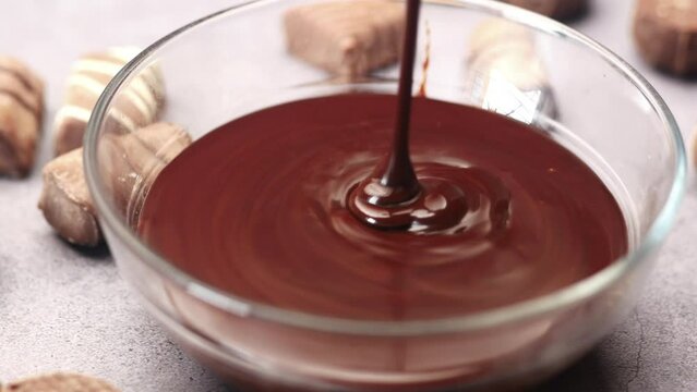 dark chocolate cream in a bowl on white 