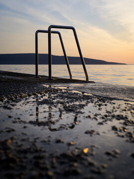 Ladder into the sea at the beach in Cres