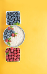 Morning with delicious oatmeal and fresh berries for a healthy diet of children, athletes. Top view of morning meal