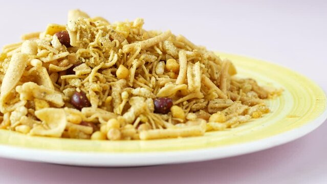 Bombay mix or Chiwda on yellow background 