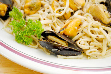 Close-up of an Atlantic Mussel and Linguini Pasta Served on a White Plate