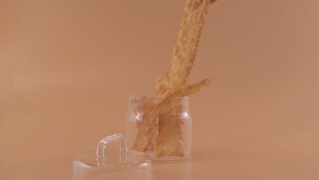 CHIACCHIERE. homemade traditional carnival sweets. Traditional sweet crisp pastry deep-fried and sprinkled with powdered sugar. Italian carnival food tradition