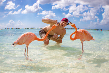 man on flamingo beach in aruba © Alyssa