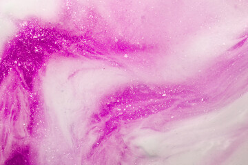 Liquid art gel pink gradient background with glitter. Slime toy. Abstract magenta and white surface. 