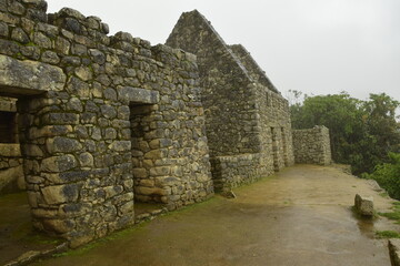 Ruins of the ancient Inca city machu picchu in fog, Peru