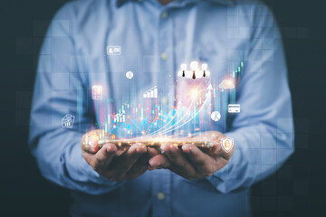 Analyzing trading of a stock exchange, Financial and banking. The planning strategy of trading stock, and business to the future. Businessman holding analyzing stocks and economic growth graph chart.