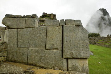 Ruins of the ancient Inca city machu picchu in fog, Peru