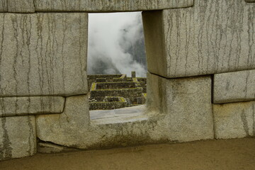 Ruins of the ancient Inca city machu picchu in fog, Peru