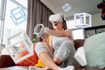 exitied enjoy 3d virtual gaming futuristic experience young asian female wear vr headset technology...