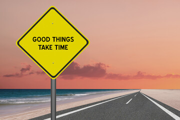 Good Things Take Time motivational quote on sign.