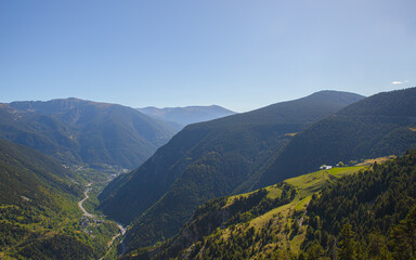 Naklejka premium Beautiful nature landscape of green mountains and a clear blue sky during a sunny spring day in Andorra
