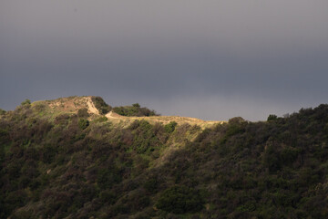 Fototapeta na wymiar Hiking Trail across the top of the mountain at Golden hour.
