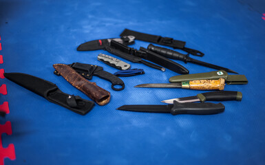 collection of combat and hunting knifes