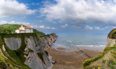 the San Telmo Hermitage chapel and Flysch rock formations on the Basque Country coast in Zumaia