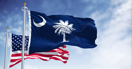 The South Carolina state flag waving along with the national flag of the United States of America - 504225669