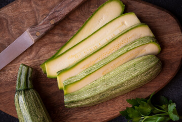 Fresh zucchini on cutting board, healthy vegetable meal