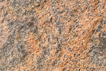 Granite stone wall texture pattern of natural mineral rock background