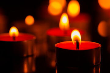 candle,Many candles burn with a shallow depth of field.