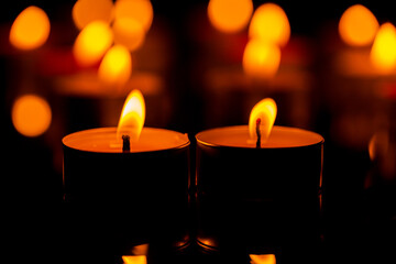 candle,Many candles burn with a shallow depth of field.