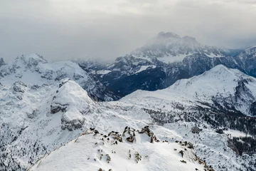 Papier Peint photo Dolomites Stormy clouds in italian dolomites in a snowy winter