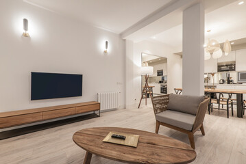 living room with vintage wooden furniture, dark wicker armchairs in short term rental apartment