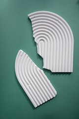 Interior still life with soft light contrast. Gypsum geometric shape on aquamarine background. Abstract composition for banner.