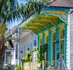 Row of colorful historic shotgun houses in Faubourg St. John neighborhood of New Orleans, LA, USA