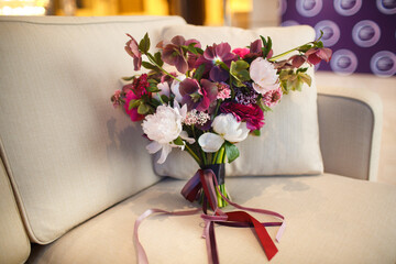Beautiful wedding bouquet on the sofa