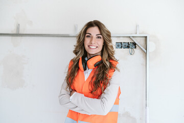 smiling professional confident architect woman in construction site. Home renovation