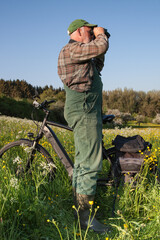 Hunters in harmony with nature. To protect the environment, an ecological hunter rode his bicycle...