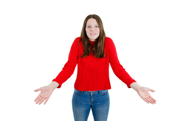 Obraz premium Confused young teenage girl in red sweater posing isolated on white wall background, studio portrait. People lifestyle concept. Mock up copy space. Rising hands up, showing palms