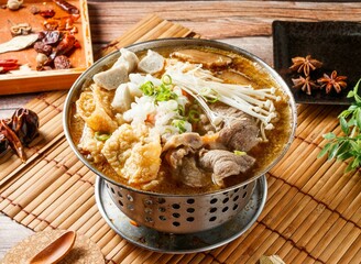 Lamb hot pot stew with red chili isolated on mat side view of japanese food