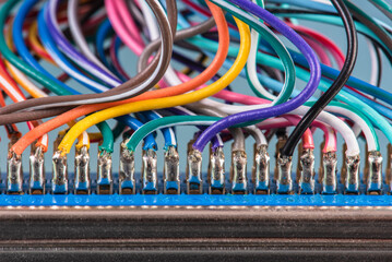 Soldered cable wire on plug close-up